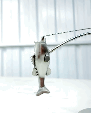 🎣Den balanserende fiskerskulpturen