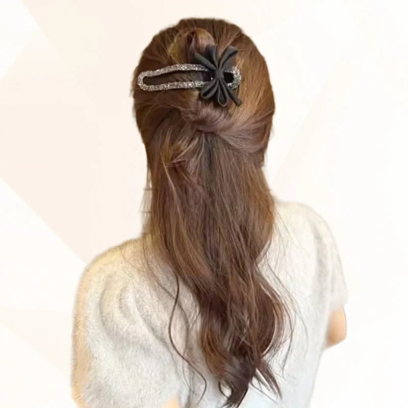 Glitrende elegant svart sløyfehårspenne